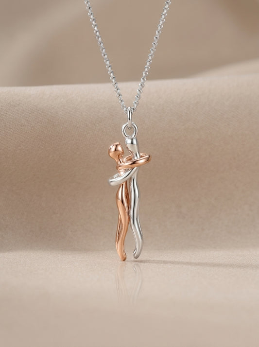 Always Close embrace necklace on a neutral background