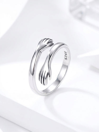 Embrace Hug Ring in a minimal jewelry setting