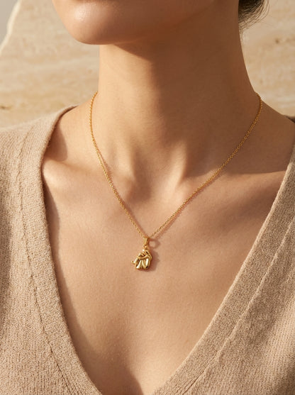 Model wearing the gold Forever Hug Dog Lover Necklace